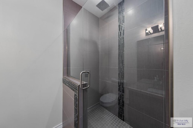 bathroom with toilet and walk in shower