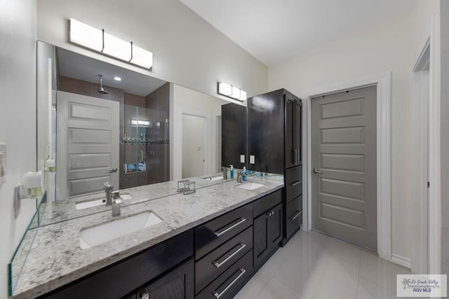 bathroom with vanity, tile patterned floors, and a shower with door