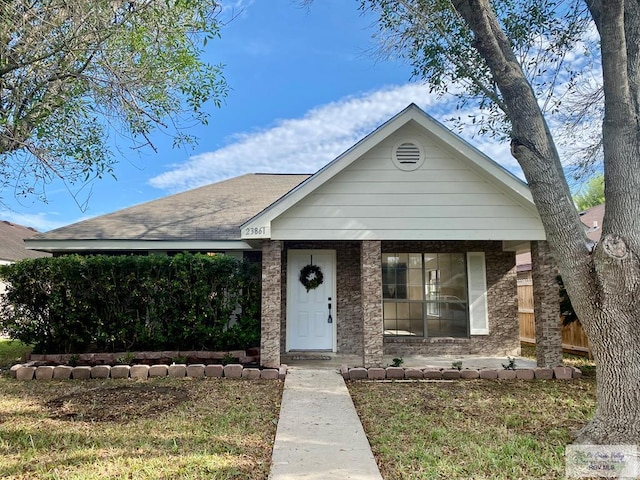 view of front of home featuring a porch and a front yard