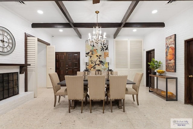 dining room featuring beamed ceiling, a brick fireplace, coffered ceiling, and a notable chandelier