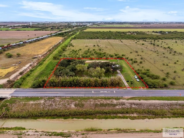 birds eye view of property with a rural view