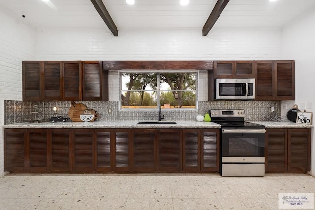 kitchen featuring stainless steel appliances, a sink, backsplash, and beamed ceiling