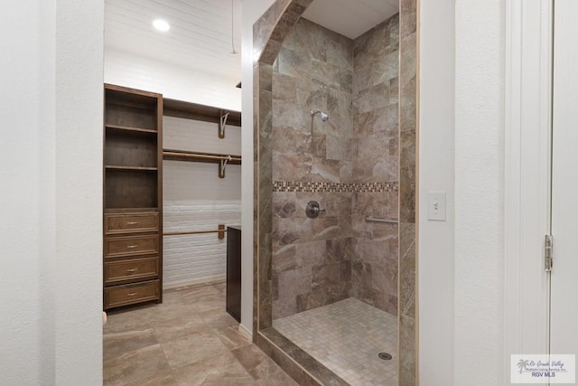 full bathroom with a tile shower