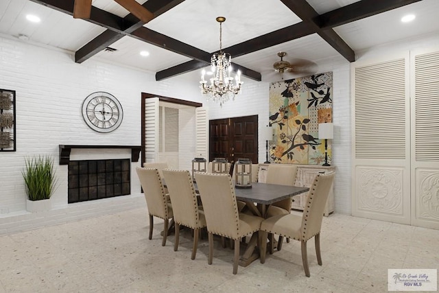 dining area featuring light floors, beamed ceiling, coffered ceiling, and a glass covered fireplace