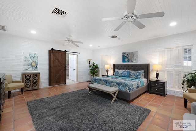 tiled bedroom featuring a ceiling fan, recessed lighting, visible vents, and a barn door