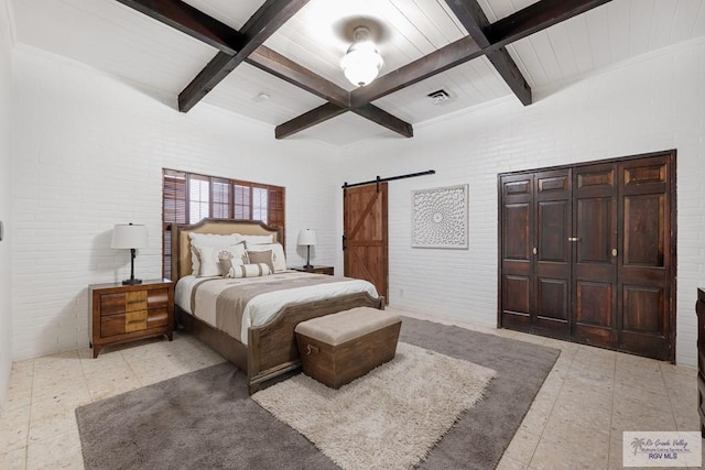 bedroom featuring a barn door, visible vents, coffered ceiling, brick wall, and beamed ceiling