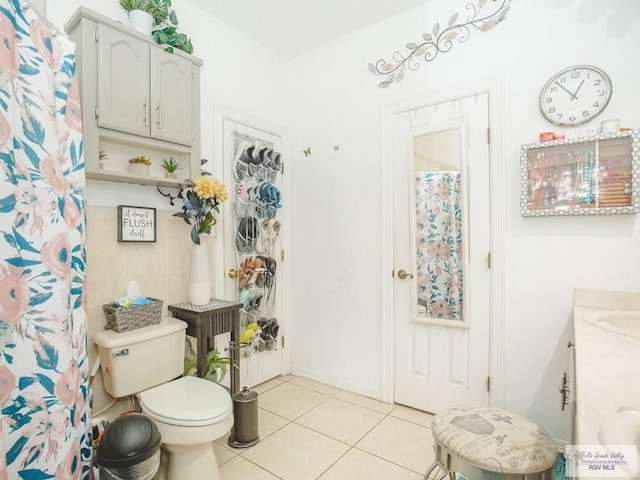 bathroom with tile patterned floors, vanity, and toilet