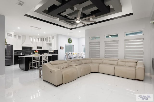 711 Santa Elena St, Weslaco, TX 78596 - living room featuring ceiling fan, light marble finish floors, a tray ceiling, recessed lighting, and coffered ceiling