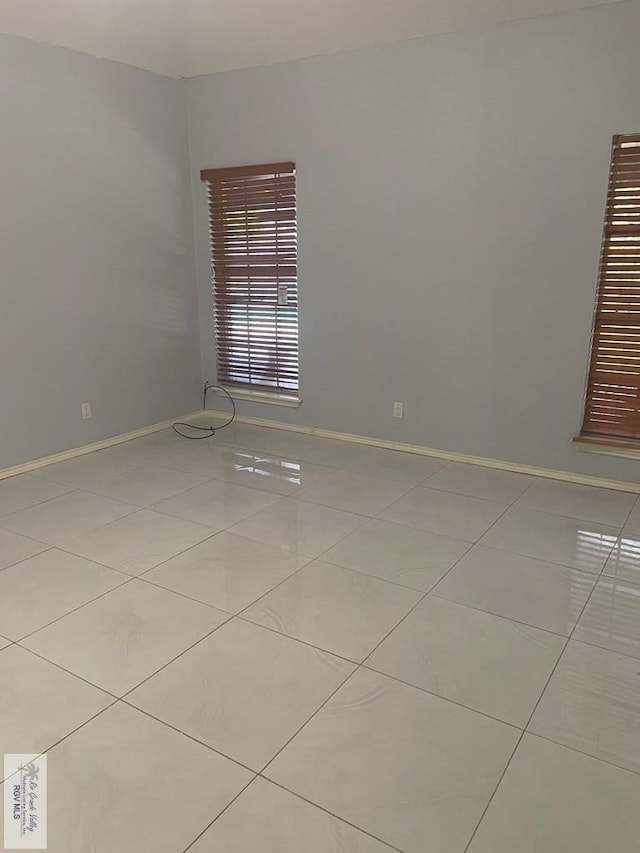 2776 Fleet St, Brownsville, TX 78521 - empty room with tile patterned flooring and baseboards