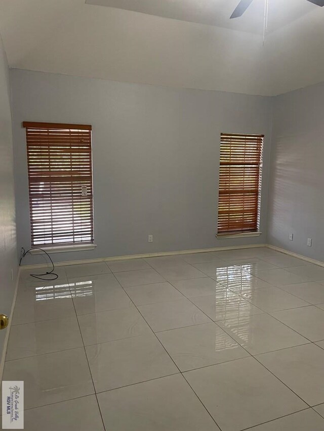 2776 Fleet St, Brownsville, TX 78521 - tiled empty room featuring a ceiling fan and baseboards