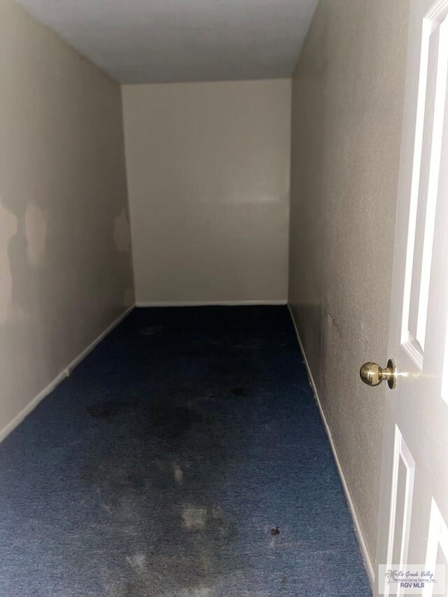 2776 Fleet St, Brownsville, TX 78521 - empty room with carpet, a textured wall, and baseboards