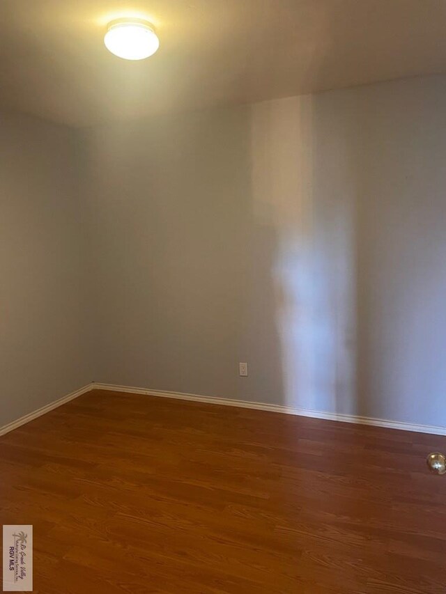 2776 Fleet St, Brownsville, TX 78521 - unfurnished room featuring wood finished floors and baseboards