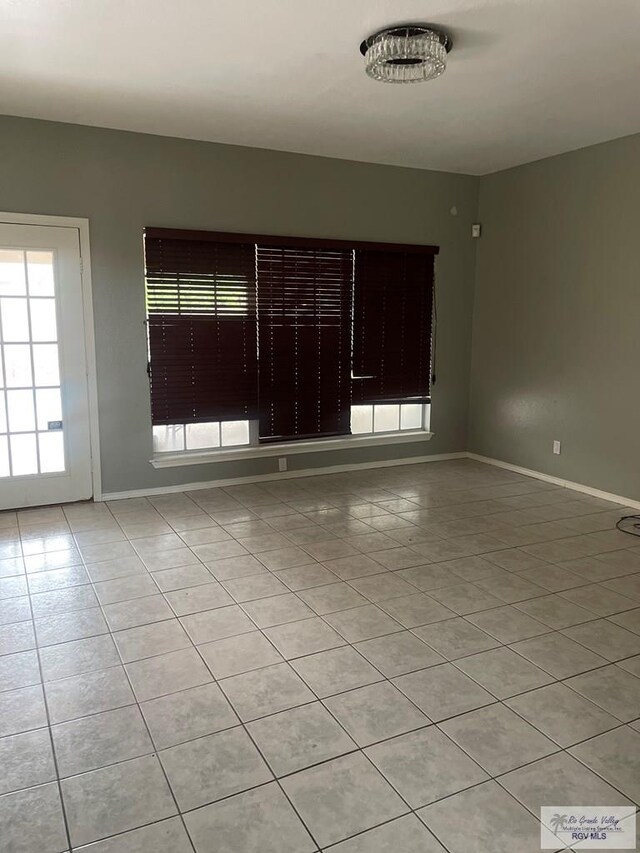 2776 Fleet St, Brownsville, TX 78521 - empty room with light tile patterned flooring and baseboards