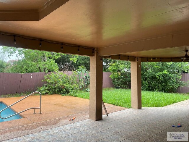 2776 Fleet St, Brownsville, TX 78521 - fenced backyard with a patio