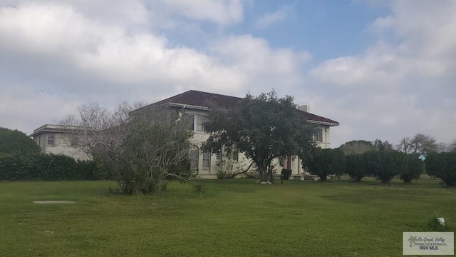 view of home's exterior featuring a yard