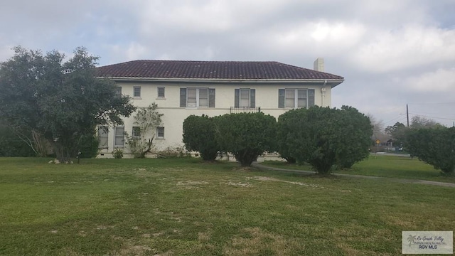 view of home's exterior with a yard