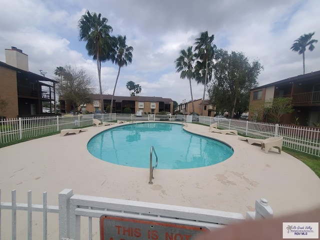 view of swimming pool with a patio