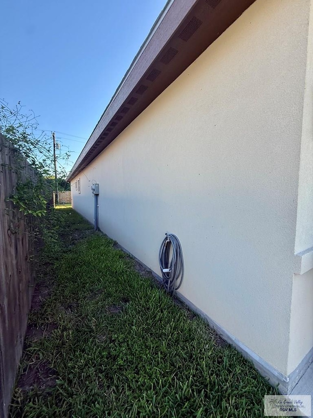 17134 Mandarin Ave, Harlingen, TX 78552 - view of home's exterior featuring stucco siding and fence