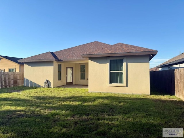 17134 Mandarin Ave, Harlingen, TX 78552 - back of property with stucco siding and a shingled roof