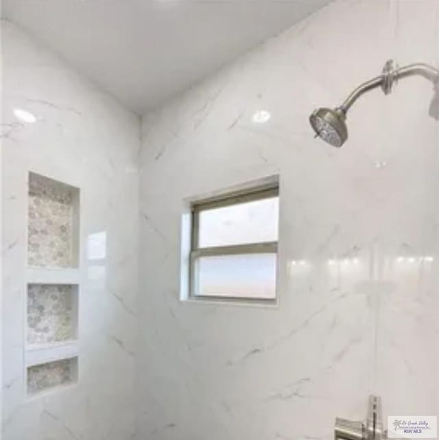 17134 Mandarin Ave, Harlingen, TX 78552 - bathroom featuring a marble finish shower