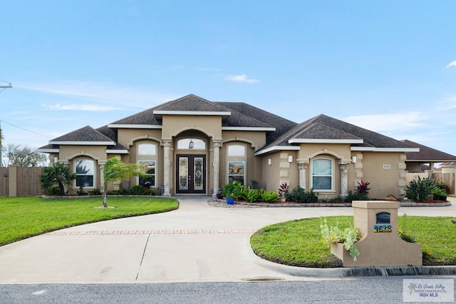 view of front of home featuring french doors and a front yard