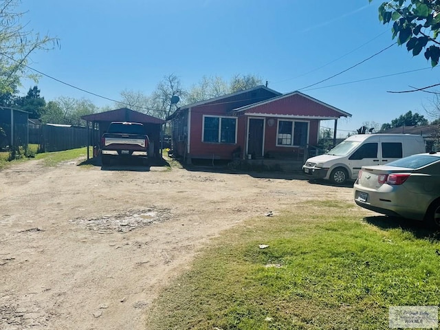 1400 Milpa Verde, Brownsville, TX 78521 - view of front of property featuring a front yard, driveway, and fence