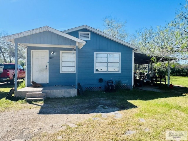 1400 Milpa Verde, Brownsville, TX 78521 - view of front of house featuring an attached carport and a front yard