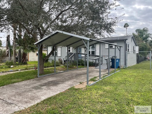 view of front of property featuring a carport and a front lawn