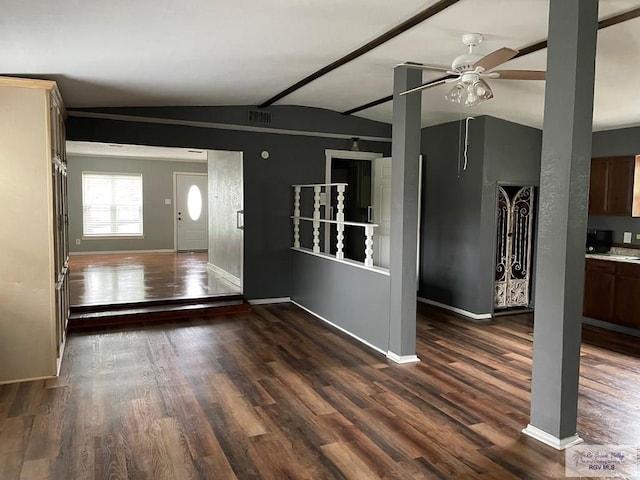 foyer entrance with lofted ceiling, dark hardwood / wood-style floors, and ceiling fan