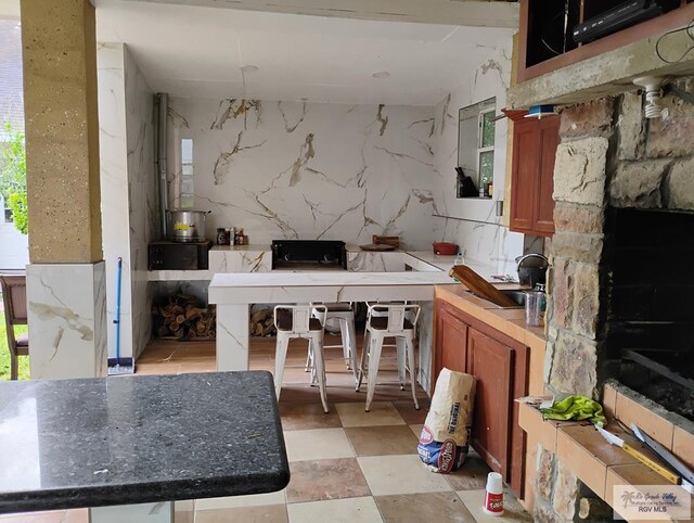 kitchen featuring a wealth of natural light and sink