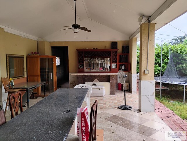 view of patio / terrace with ceiling fan and a trampoline