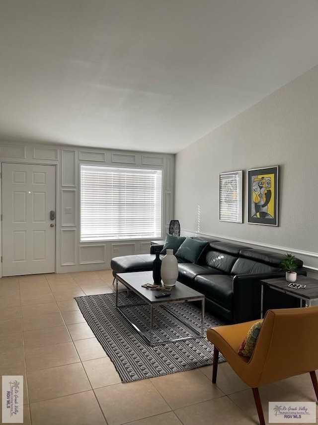 tiled living room with lofted ceiling