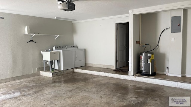 garage featuring washing machine and clothes dryer, a garage door opener, electric panel, and water heater