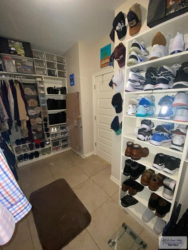 spacious closet featuring tile patterned floors