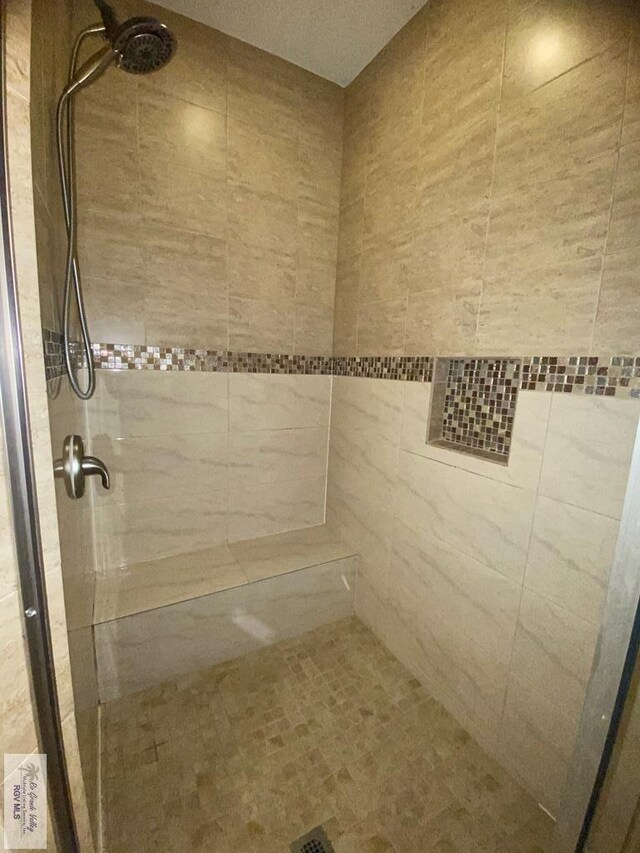 116 Village E Dr, Los Fresnos, TX 78566 - bathroom featuring a tile shower