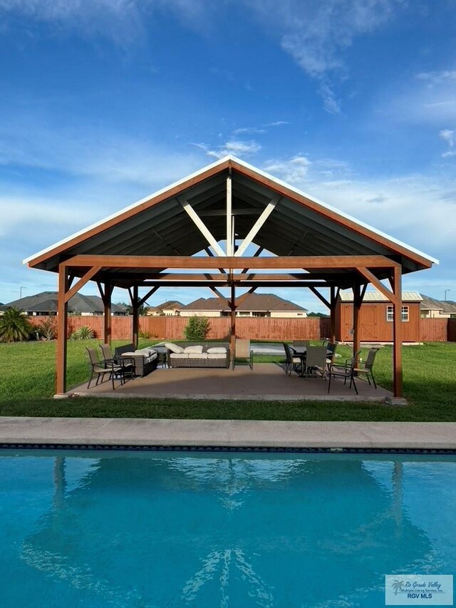 view of swimming pool with a gazebo, a yard, and a patio area