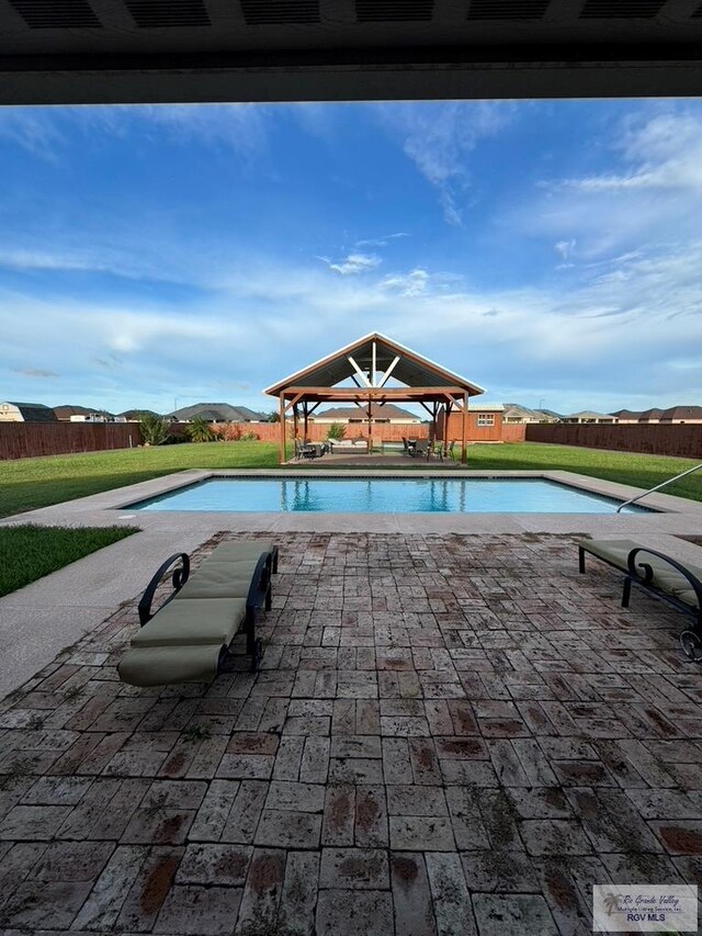 view of swimming pool featuring a gazebo and a lawn