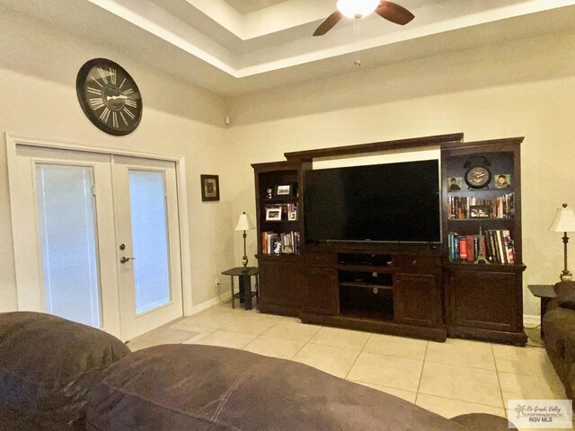 116 Village E Dr, Los Fresnos, TX 78566 - tiled living room with french doors, a ceiling fan, and baseboards