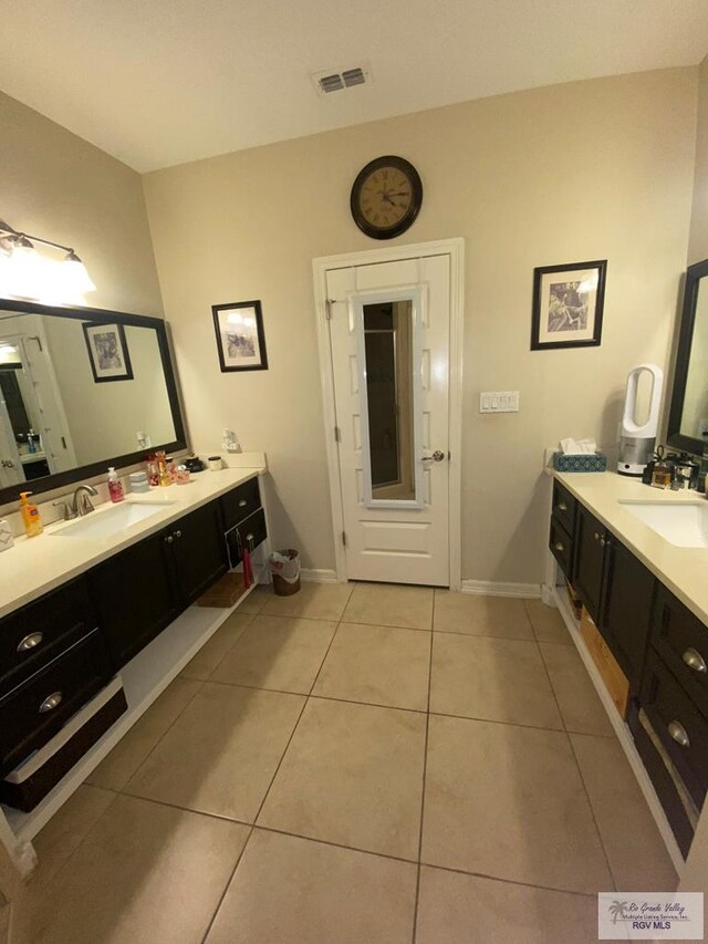 bathroom featuring tile patterned floors and vanity