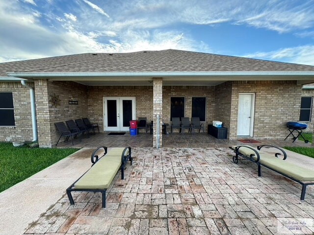 rear view of house featuring a patio area and french doors