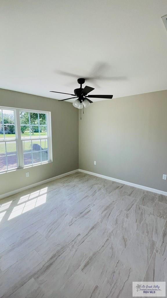 unfurnished room with ceiling fan