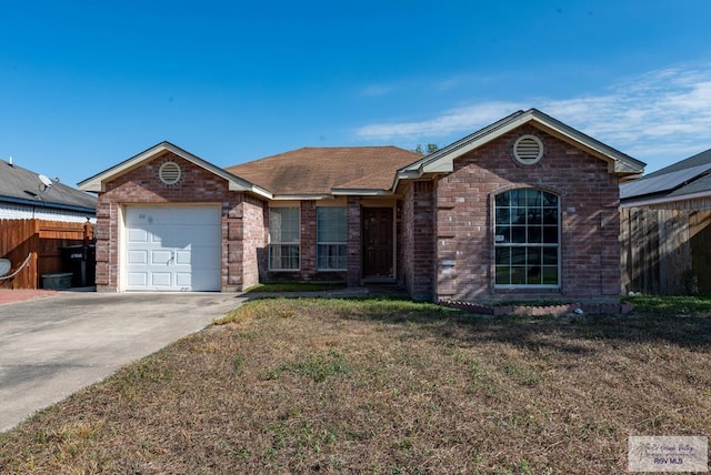 ranch-style house with a front yard and a garage