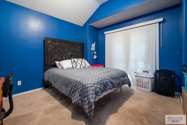 bedroom featuring light colored carpet and vaulted ceiling