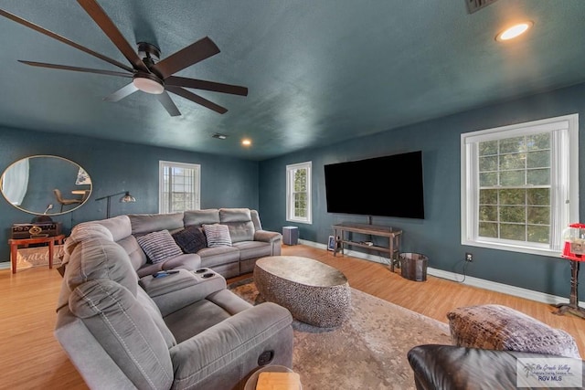 living room with hardwood / wood-style flooring and a wealth of natural light