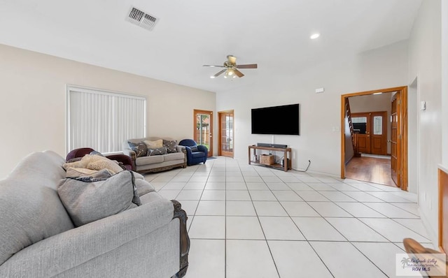 tiled living room with ceiling fan