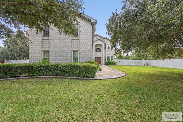 view of front of home with a front lawn