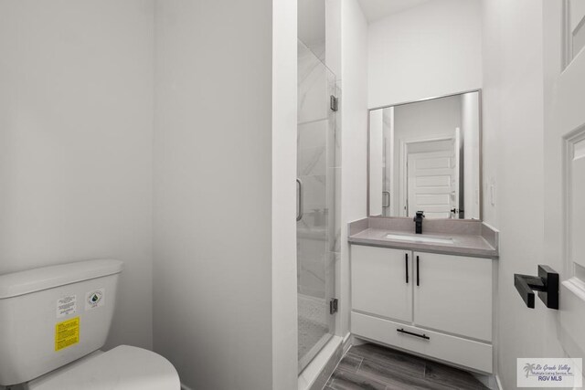 laundry area featuring hardwood / wood-style flooring, hookup for an electric dryer, and water heater