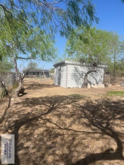 1151 S Texas, Mercedes, TX 78570 - view of yard featuring fence