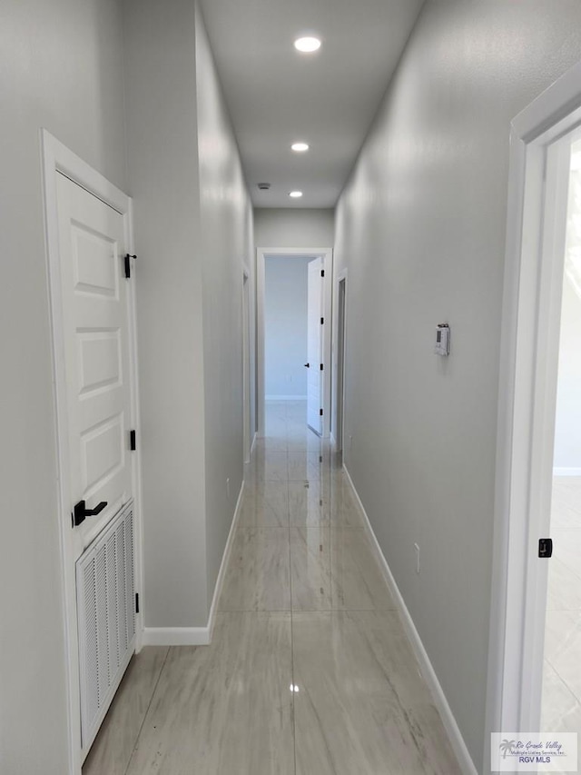 hallway featuring recessed lighting, visible vents, and baseboards