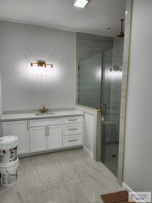 bathroom featuring a shower stall and vanity